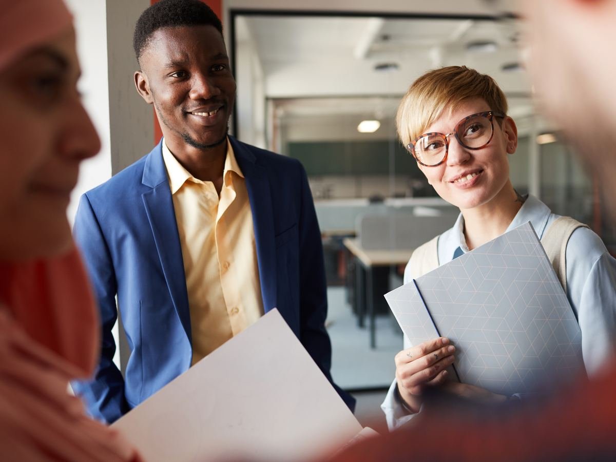 A diverse business team communicating and exchanging ideas in an office