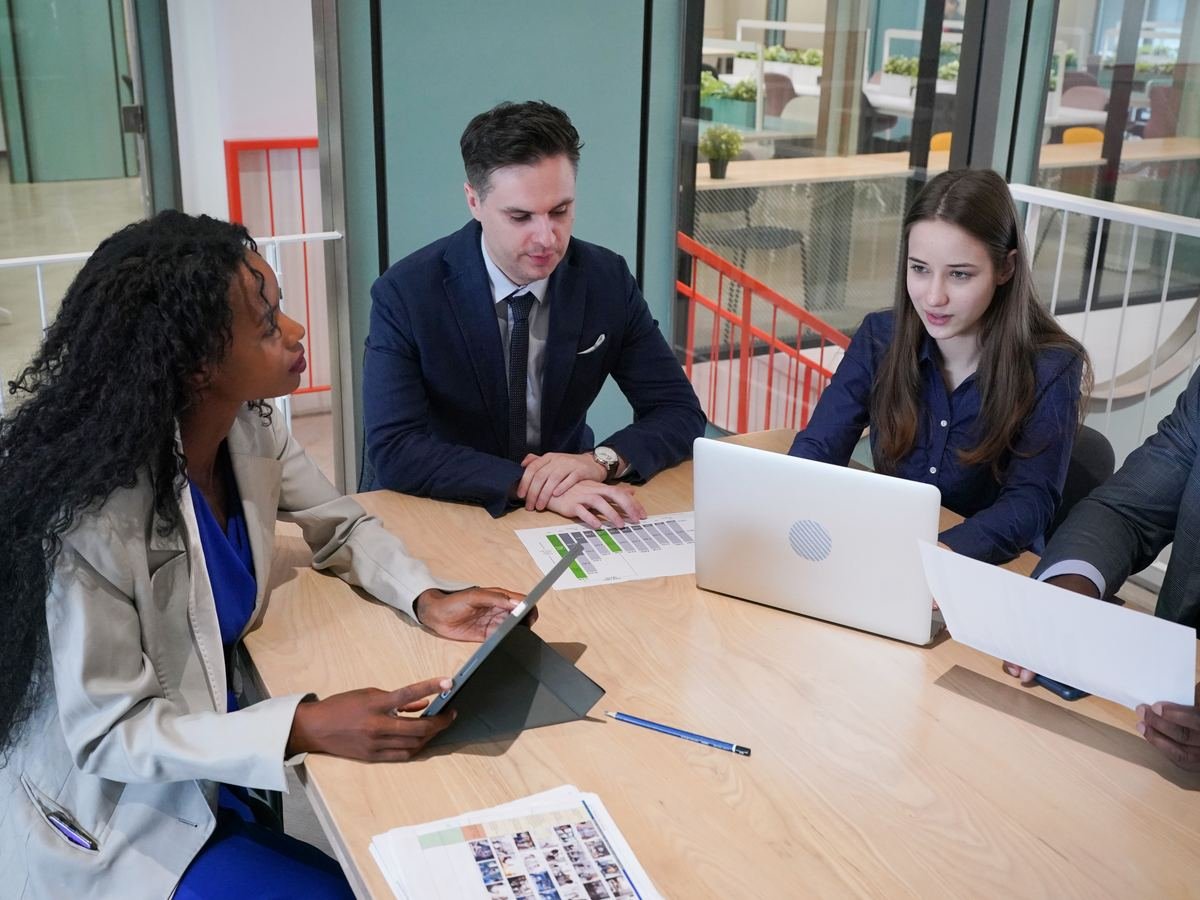 Business professionals meeting at an office table to discuss partnership