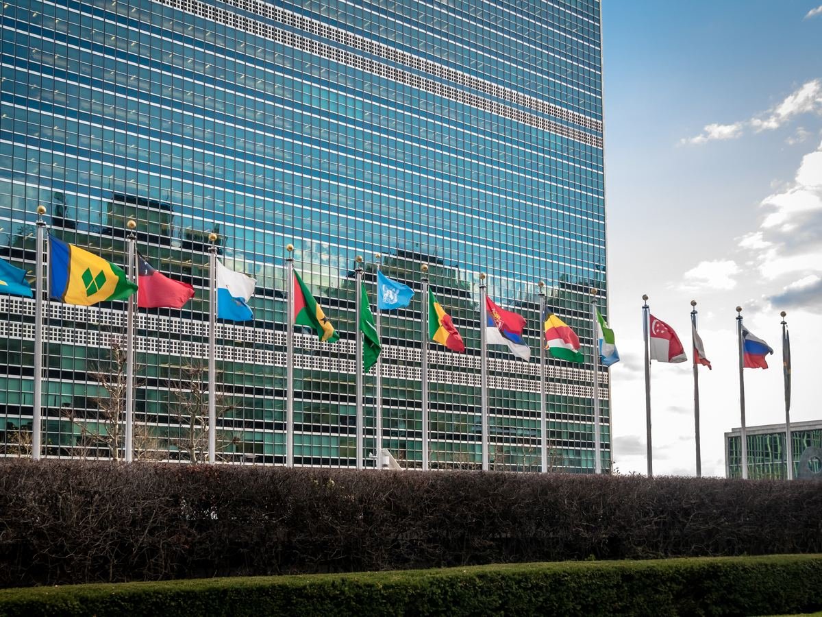 Flags of nations outside an international institution, representing the UN Universal Periodic Review