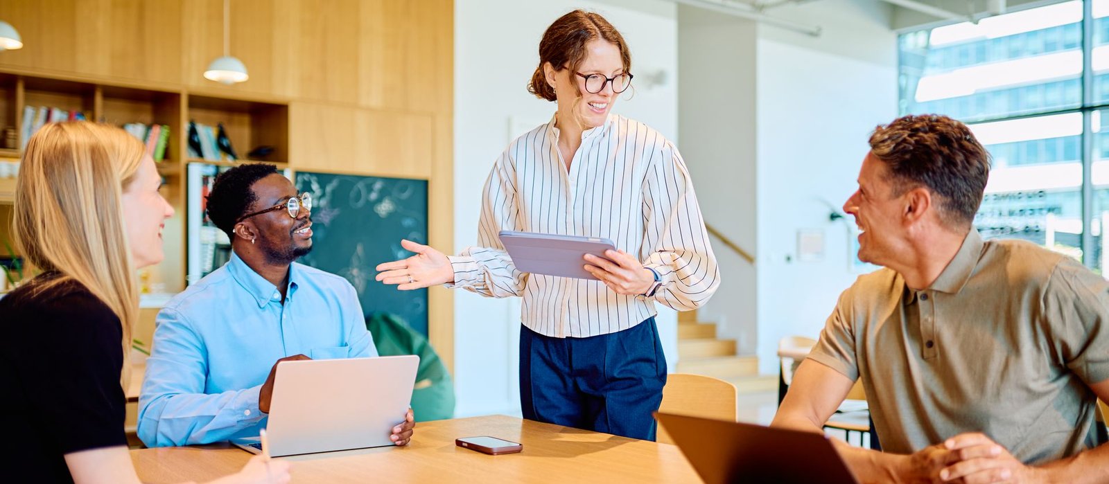 A business team collaborating during a casual office meeting