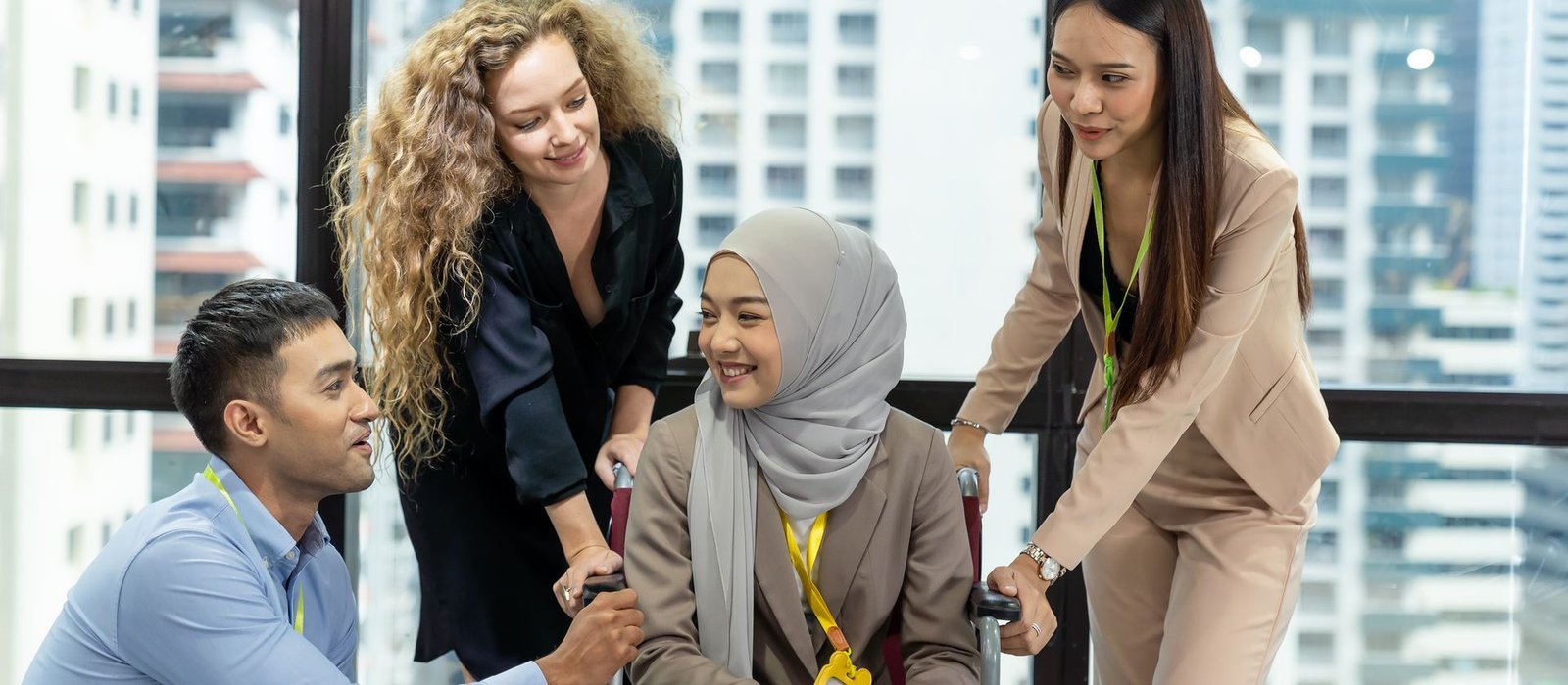 Colleagues collaborating warmly in an inclusive office setting